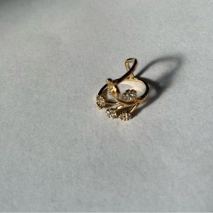 Floral design ring adjustable yellow gold color.